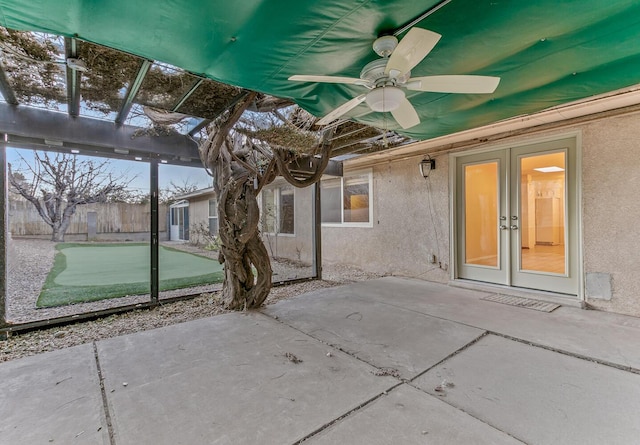 view of patio featuring ceiling fan and french doors