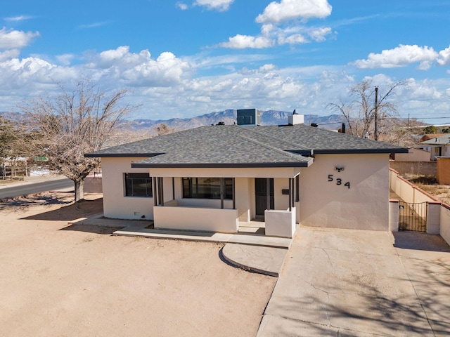 rear view of property with a mountain view