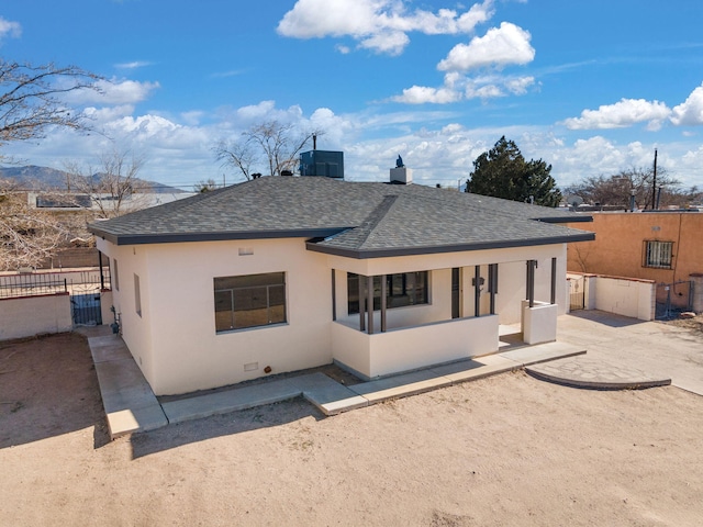 rear view of house featuring cooling unit