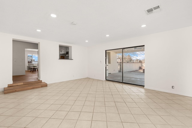 spare room featuring light tile patterned floors