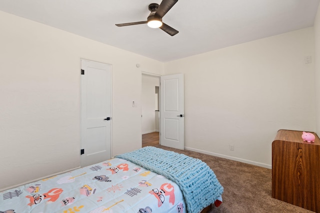 bedroom featuring ceiling fan and dark colored carpet