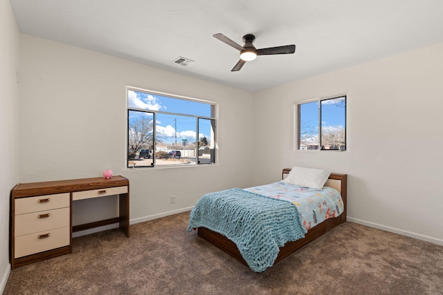 bedroom featuring ceiling fan and dark colored carpet