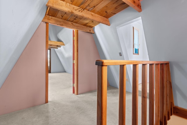 bonus room with vaulted ceiling with beams, light colored carpet, and wooden ceiling