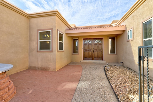 property entrance with a patio