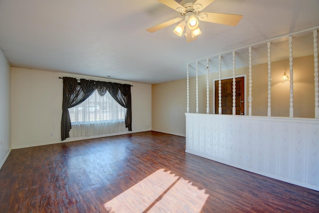 unfurnished room featuring dark hardwood / wood-style floors and ceiling fan