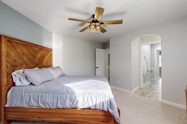 bedroom featuring ceiling fan and light carpet