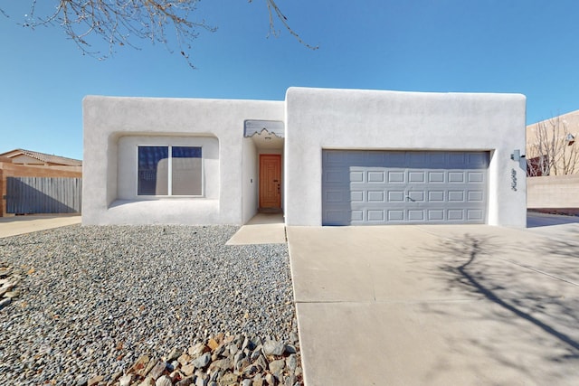 southwest-style home with a garage