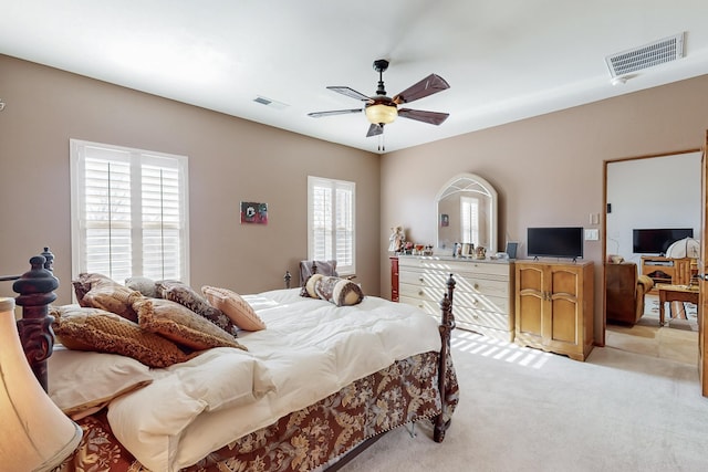 bedroom with light colored carpet and ceiling fan