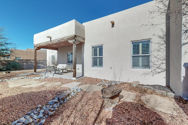 rear view of house with a patio