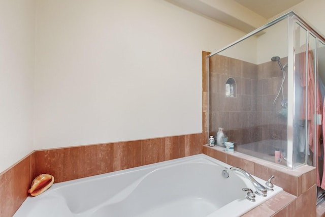 bathroom with shower with separate bathtub