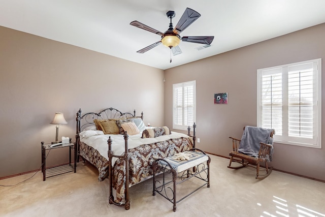 bedroom featuring light colored carpet and ceiling fan