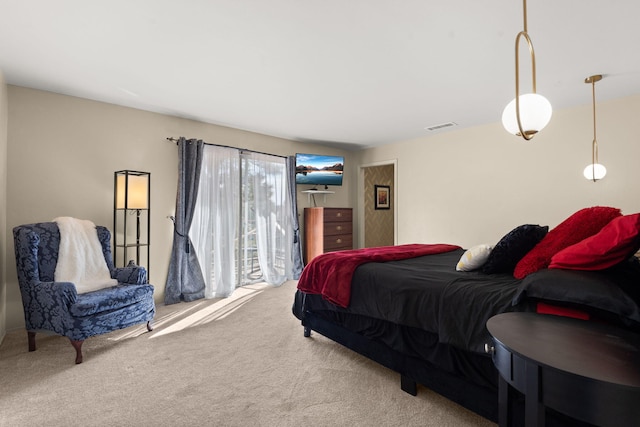 carpeted bedroom featuring access to outside