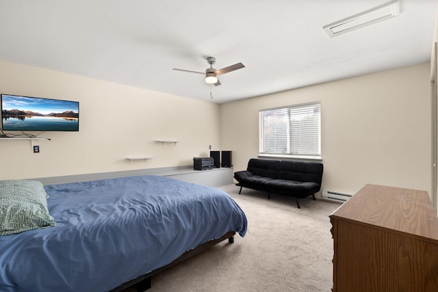 carpeted bedroom with a baseboard radiator and ceiling fan