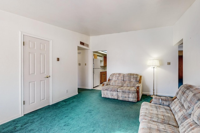 carpeted living room featuring vaulted ceiling