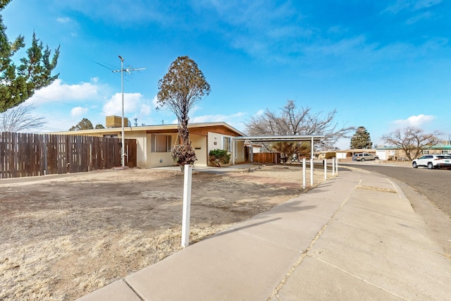 view of front of property with a carport