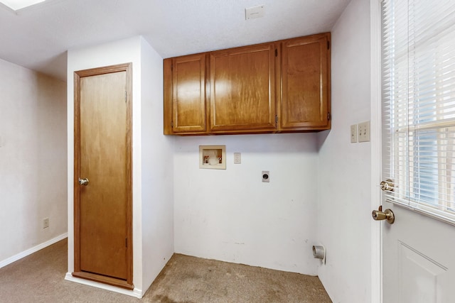 clothes washing area with cabinets, hookup for a washing machine, light colored carpet, and hookup for an electric dryer