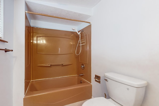 bathroom with bathing tub / shower combination and toilet