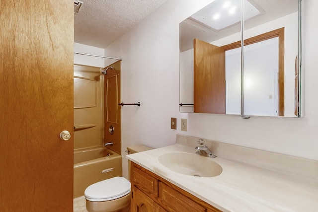 full bathroom with vanity,  shower combination, toilet, and a textured ceiling