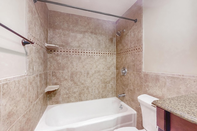 full bathroom featuring vanity, toilet, and tiled shower / bath combo