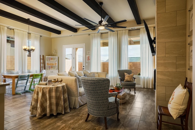 living area with beam ceiling and ceiling fan with notable chandelier