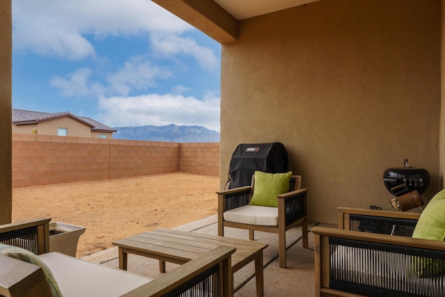 view of patio featuring a mountain view and grilling area