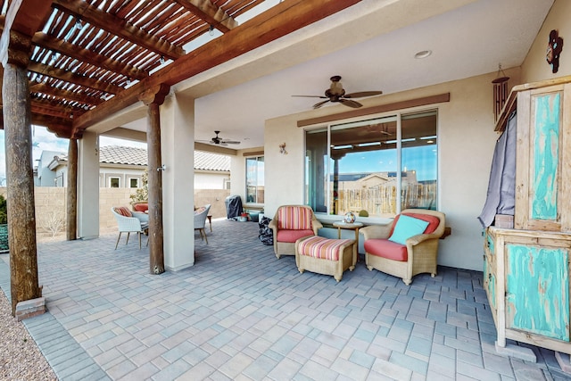 view of patio / terrace featuring ceiling fan and a pergola