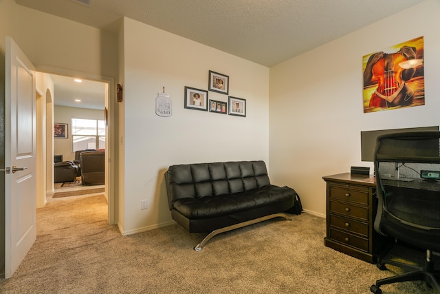 carpeted office featuring a textured ceiling, recessed lighting, and baseboards