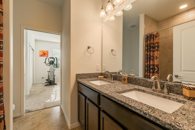 bathroom with a shower with curtain, visible vents, a sink, and tile patterned floors