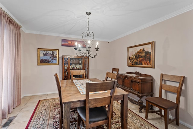 tiled dining area with an inviting chandelier and crown molding