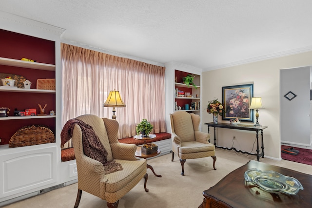 sitting room with light carpet, crown molding, built in shelves, and a textured ceiling