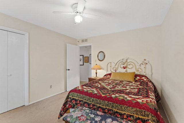 bedroom featuring ceiling fan and light colored carpet