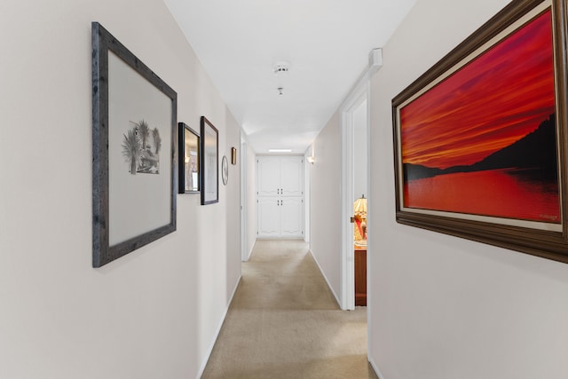 hallway with light colored carpet