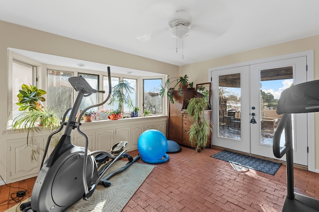 exercise room with french doors and ceiling fan