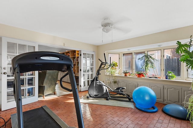 workout area with ceiling fan and a healthy amount of sunlight