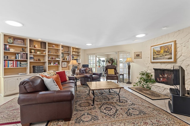 tiled living room featuring a fireplace