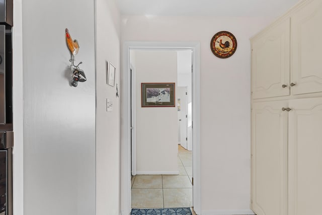 hallway with light tile patterned floors