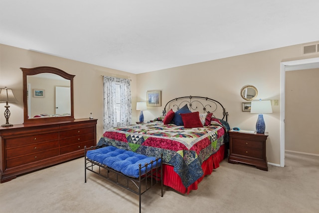 bedroom featuring light carpet