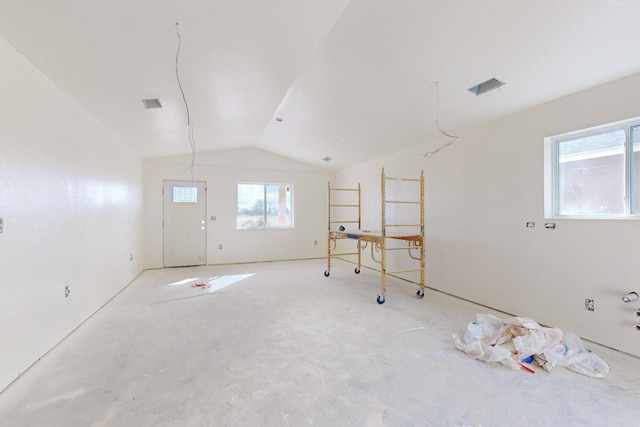 spare room featuring vaulted ceiling