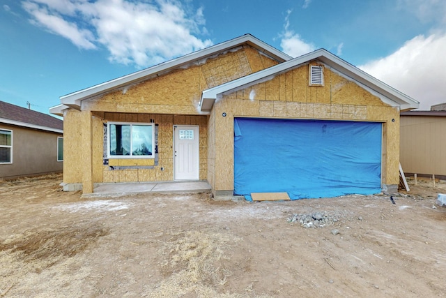 property under construction featuring a garage