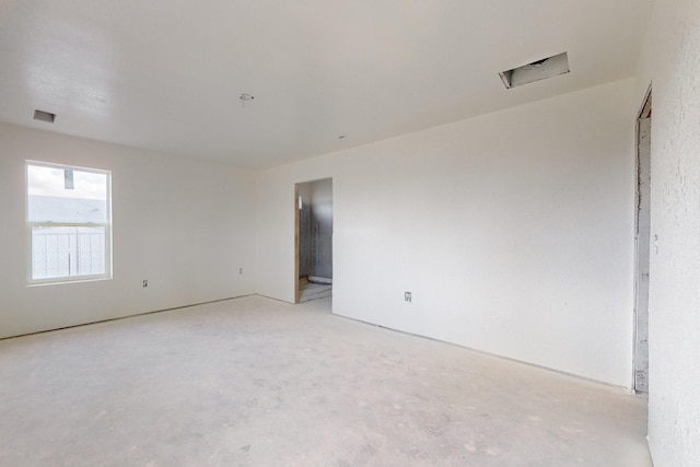 empty room featuring visible vents and concrete flooring