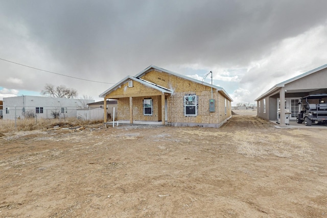 view of front of house featuring fence
