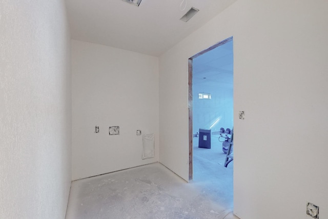spare room featuring unfinished concrete floors