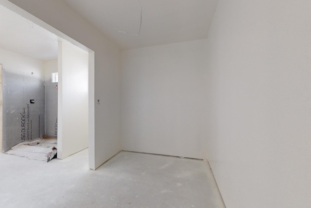 spare room featuring concrete flooring