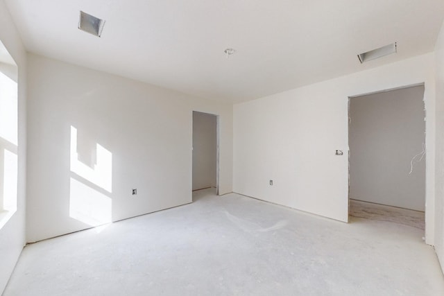 empty room with concrete flooring