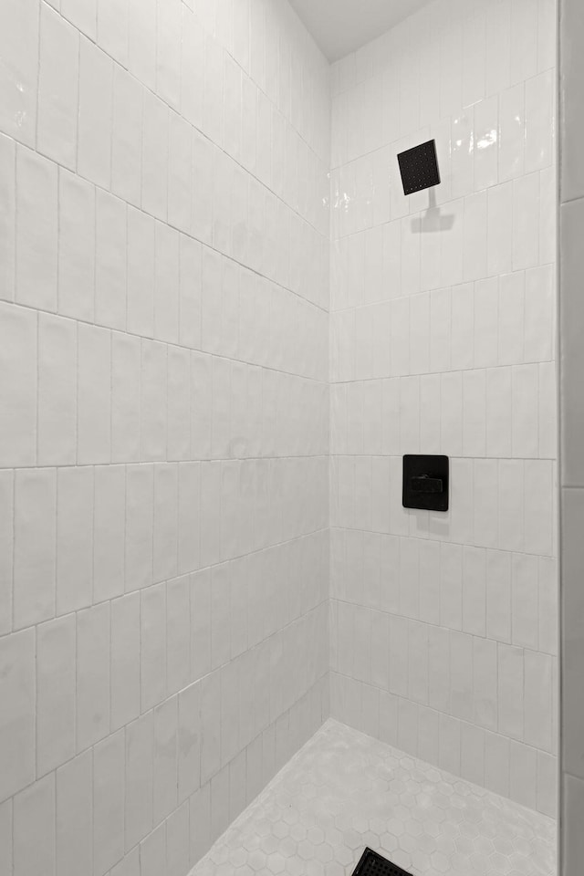 bathroom with tiled shower