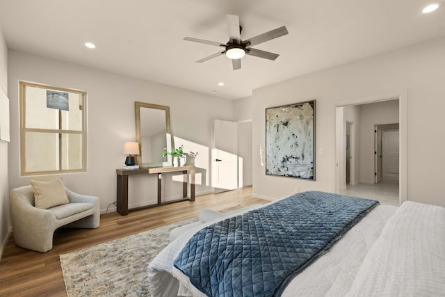 bedroom featuring hardwood / wood-style flooring and ceiling fan