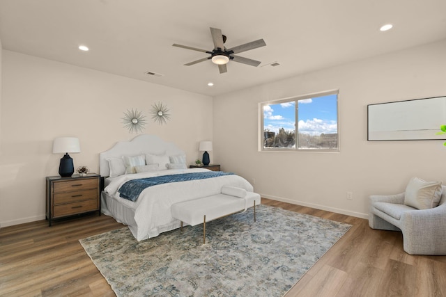 bedroom featuring wood-type flooring and ceiling fan