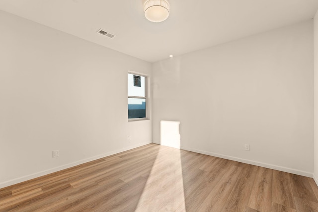 empty room with light wood-type flooring