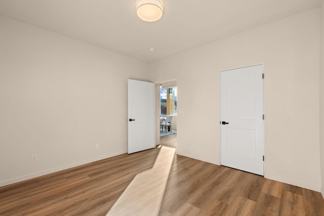 spare room featuring light hardwood / wood-style flooring