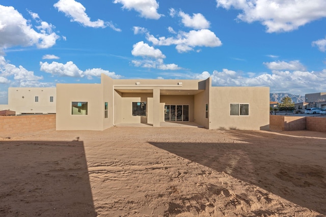 back of property with a patio area